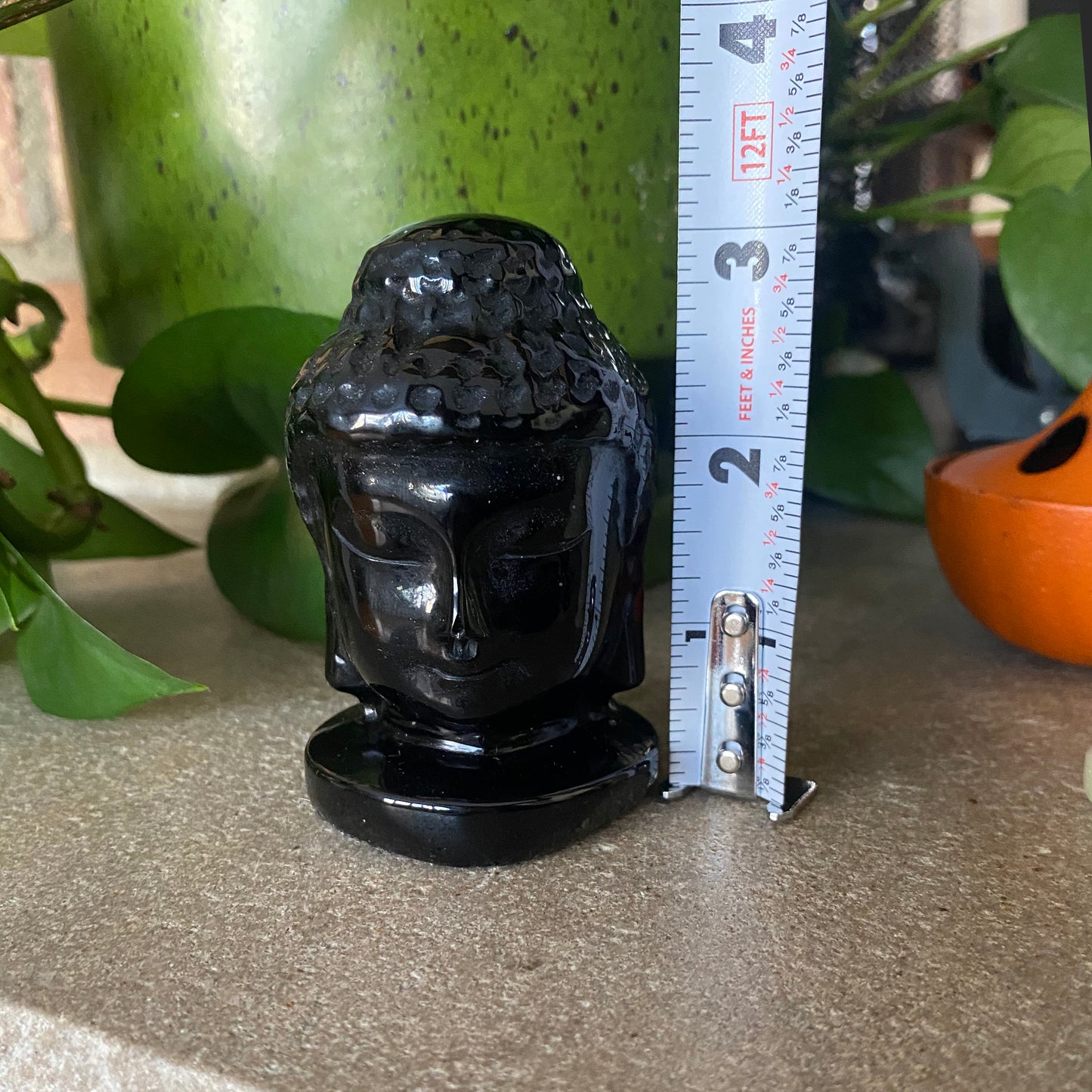 Carved Obsidian Buddha