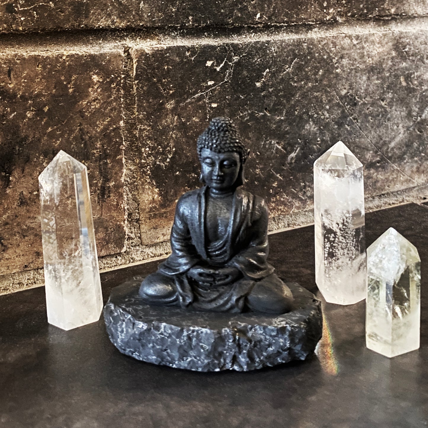 Shungite Buddha figurine on Rock