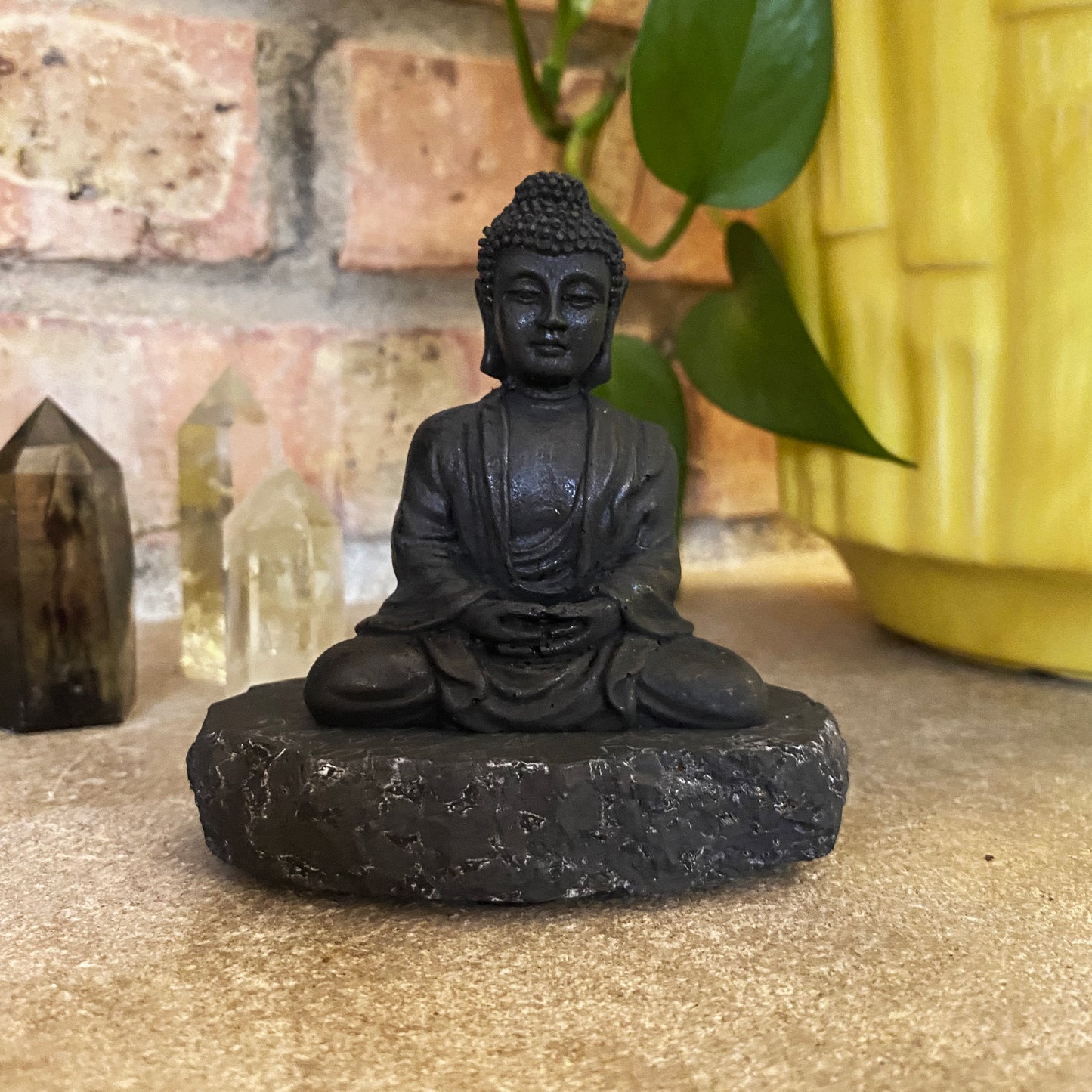 Shungite Buddha figurine on Rock